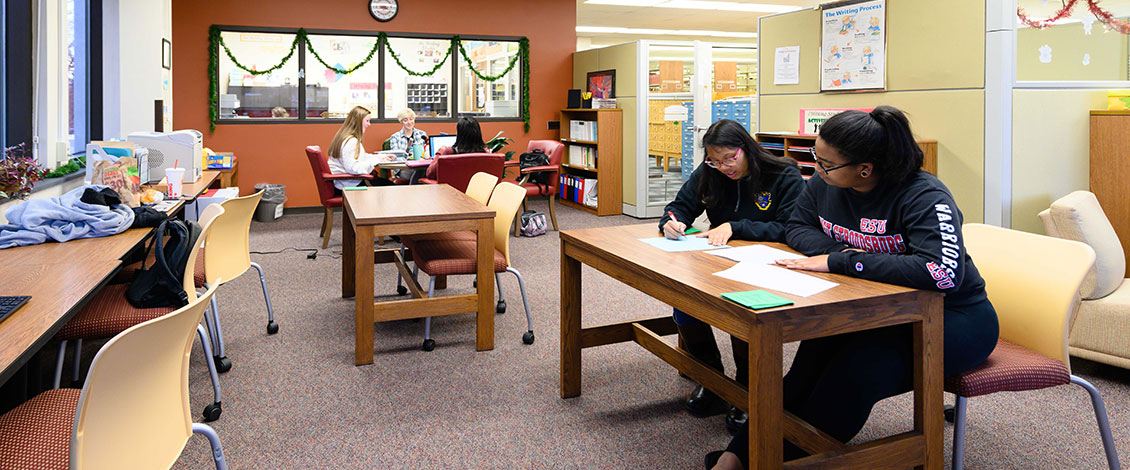 Students work with tutors in the Writing Studio