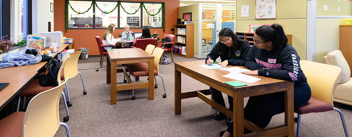 Students work with tutors in the Writing Studio